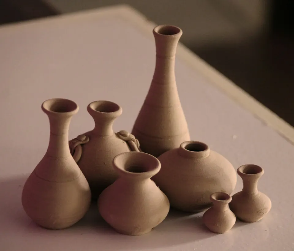 Small terracotta vases on a table
